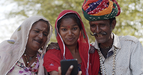 Indian family with smartphone